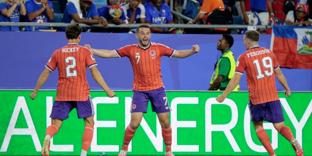 Escócia vence Haiti e vira líder do grupo do Brasil
